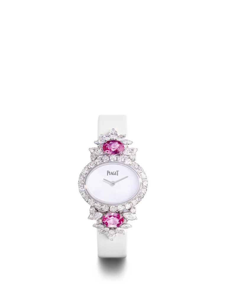 18K white gold watch with white satin strap. Additional black satin strap available.
