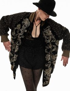 Hat; jacket; top; and shorts, all from Saint Laurent by Anthony Vaccarello.