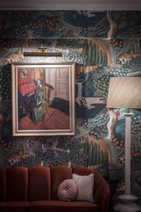 The sitting room at the hotel features custom illustrations of the Bloomsbury Set