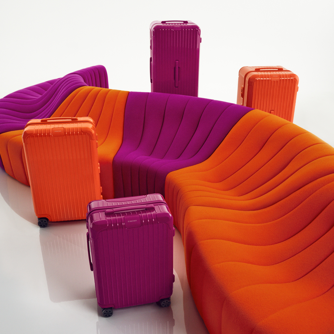 RIMOWA steps into the spotlight with new orange and magenta colourways that encapsulate the essence of summer. 